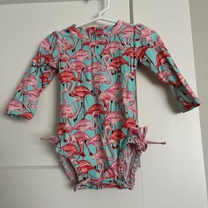 Ruffle Butts rash guard one piece. Only used 2x. Excellent condition no piling!